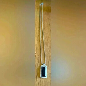 NY & CO vintage silver tone necklace and rectangular pendant with black stone.